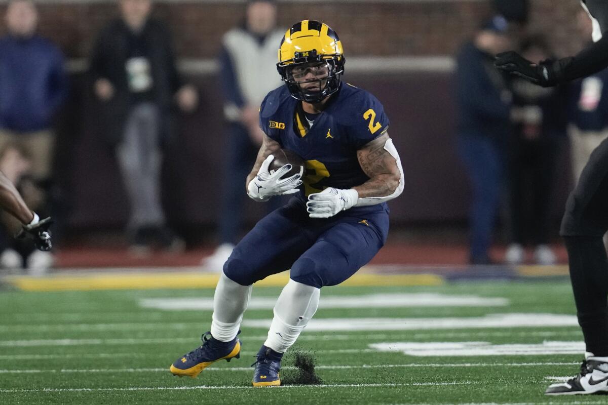 Michigan star Corum says he had no business with Stalions unaware